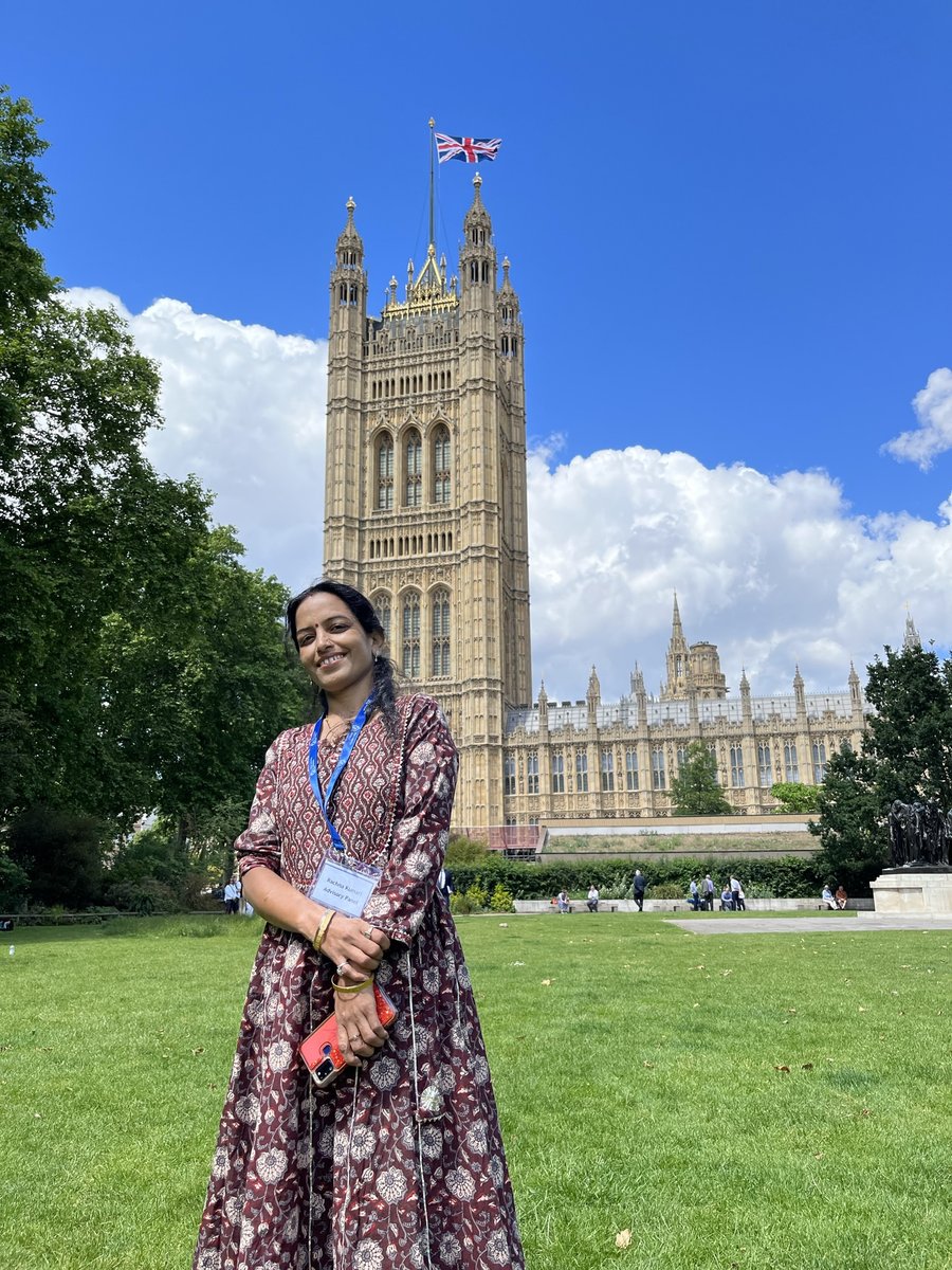 Rachna poses outside the UK Parliament building