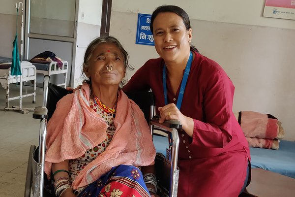 Phulti was sent to live in a cave by her family, but now she receives care at TLM's Anandaban Hospital. Here she poses for a photo with Ruth, from the TLM staff.