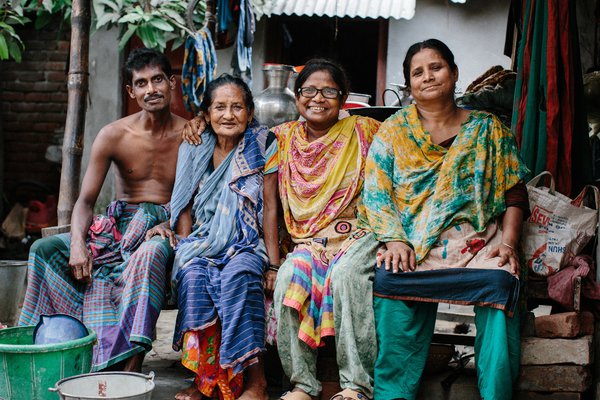 A family in Bangladesh smiles for the camera