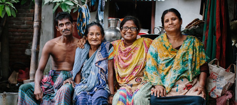 A family in Bangladesh smiles for the camera