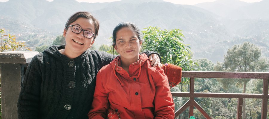 Rita sits with Nursing Superintendent Mahima Bantawa