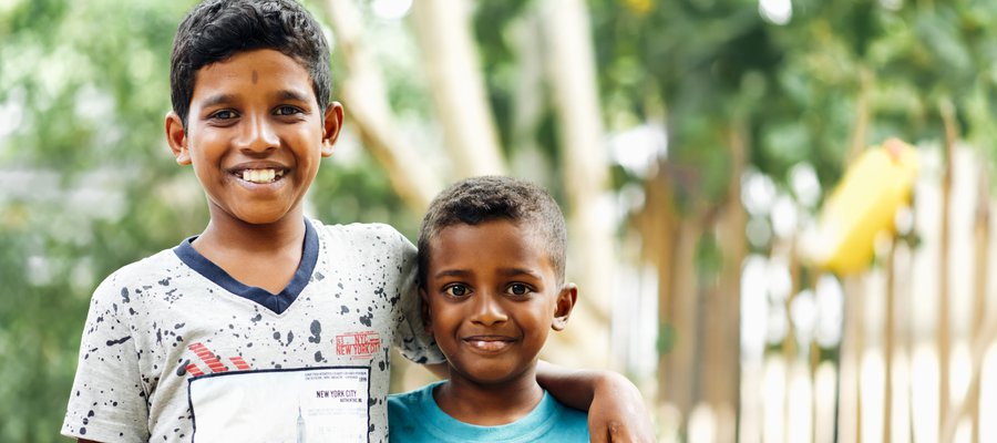 Kavinas with smiles at the camera with his younger brother, Hariskram