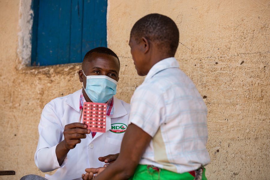 A doctor holds a pack of MDT