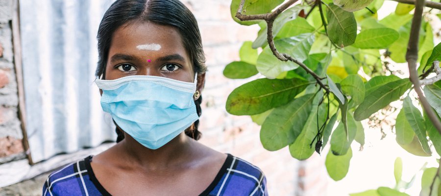 A girl in Sri Lanka wearing a face mask