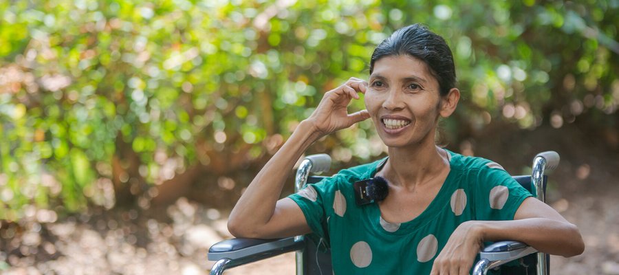 An older woman laughing.