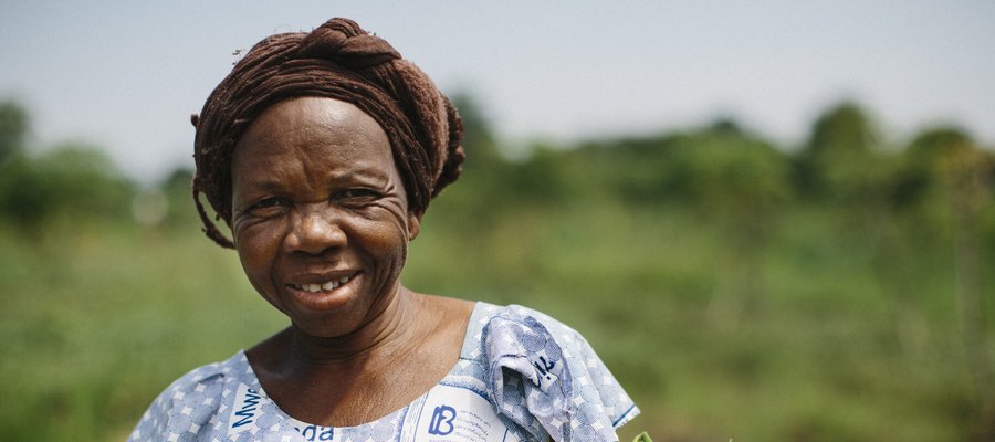 An older woman smiling at the camera.