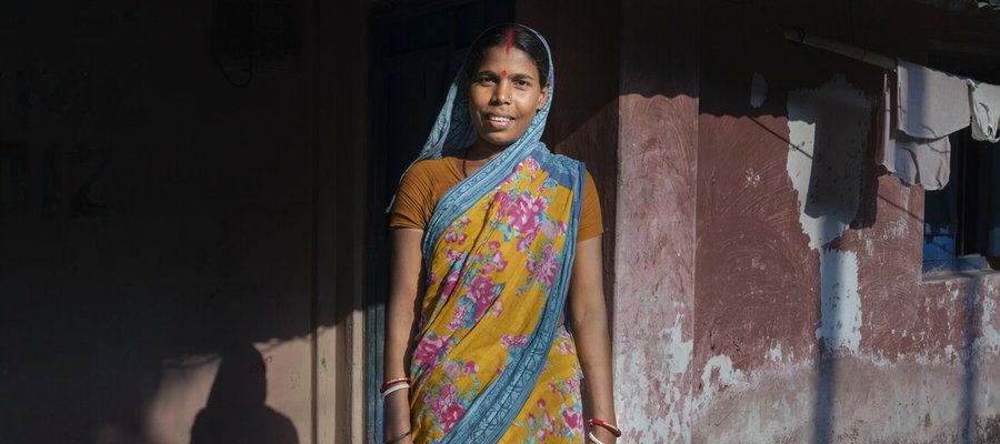 An older woman smiling at the camera.