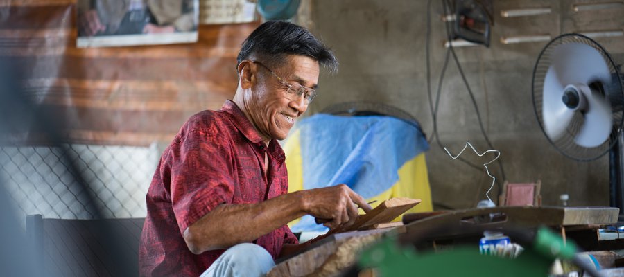 Patana does woodwork in his workshop