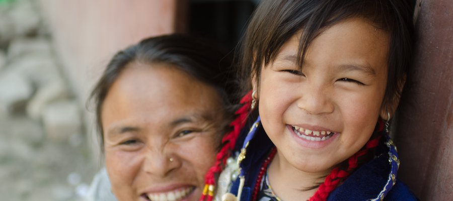 Mother and daughter in Nepal smile at the camera