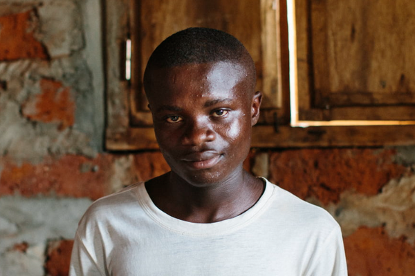 A younger boy looking into the camera.