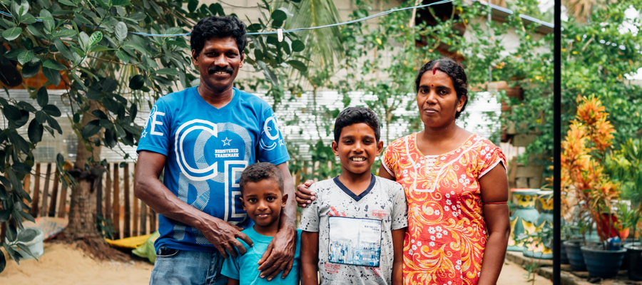 A family in Sri Lanka pose for a photo. They were denied access to school because of leprosy.