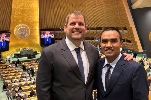 Mathias Duck from Paraguay stands with Dinesh Basnet from Nepal in the UN General Assembly Hall