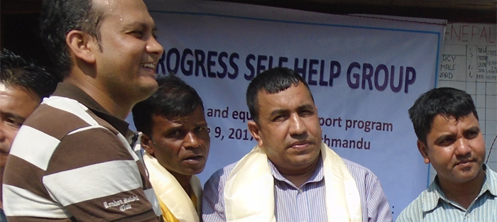 Tara, on the left, stands at the front of a celebration event in Nepal